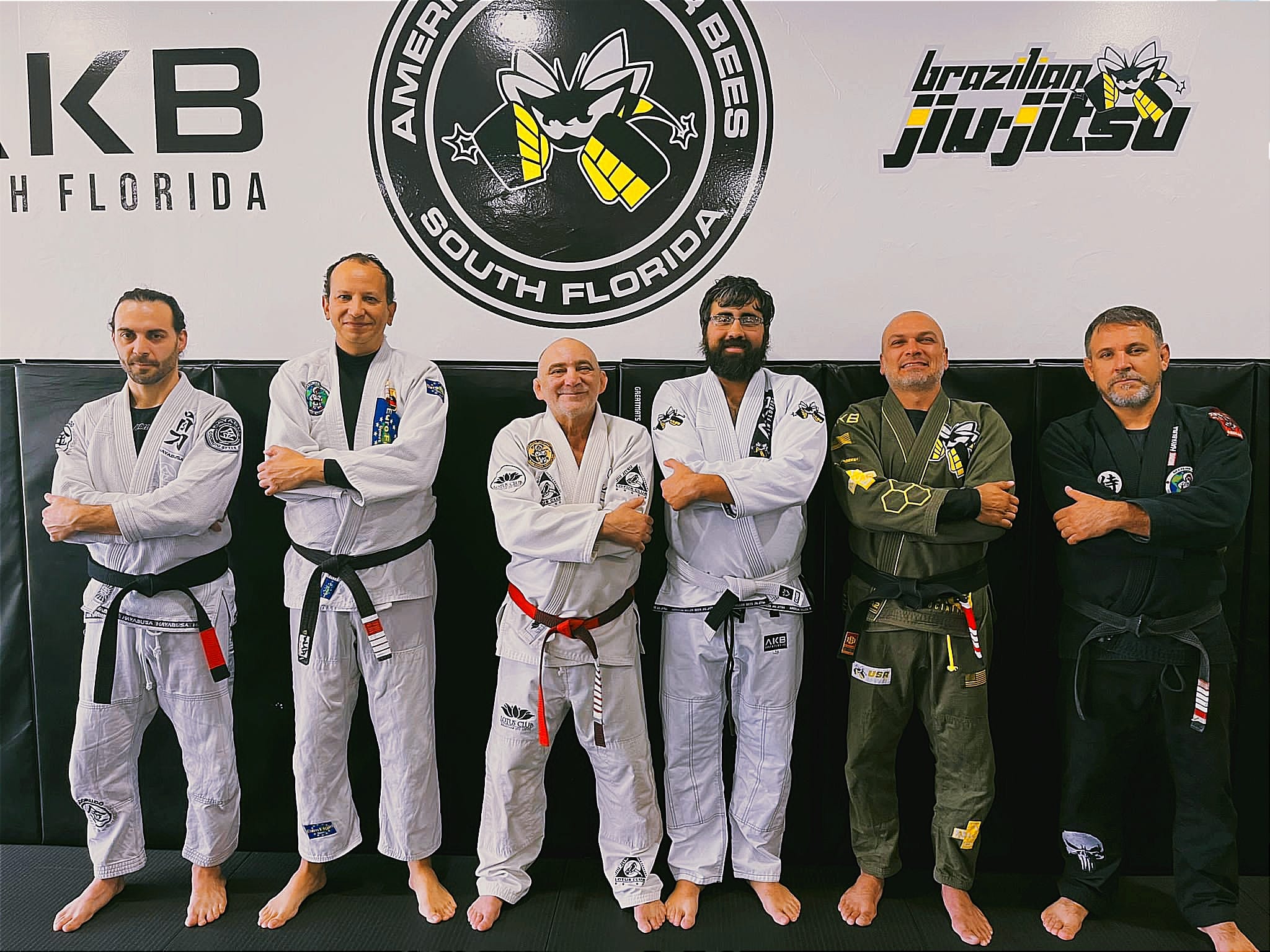 Experienced Brazilian Jiu-Jitsu black belts together on the mat